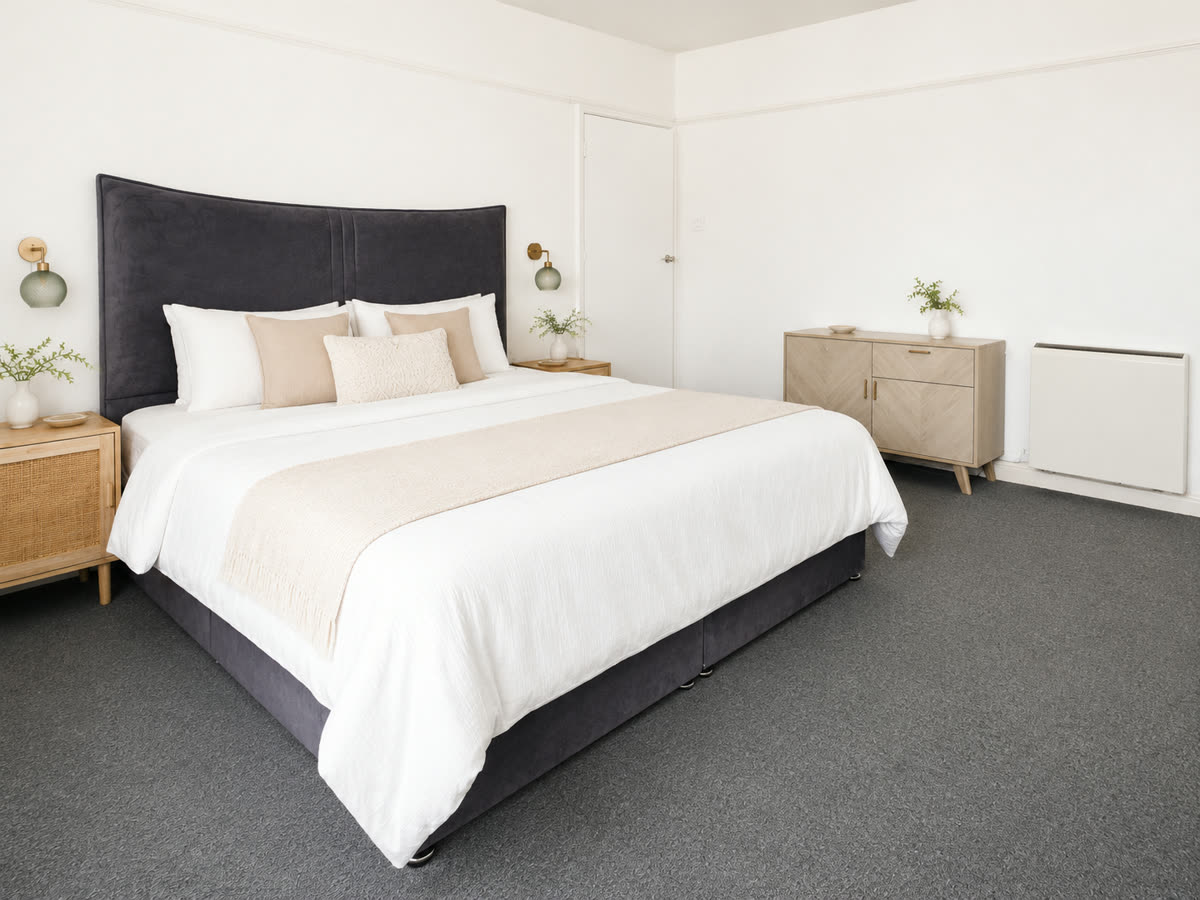 The bedroom seen from the opposite corner, showing its full length
